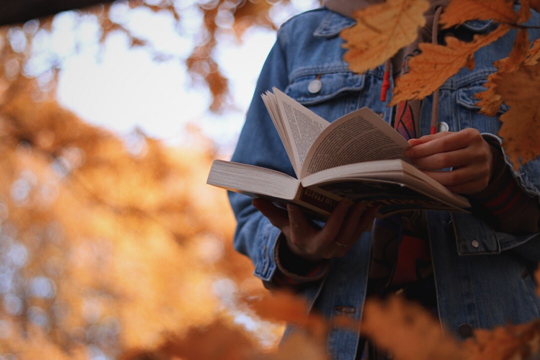person reading self help book