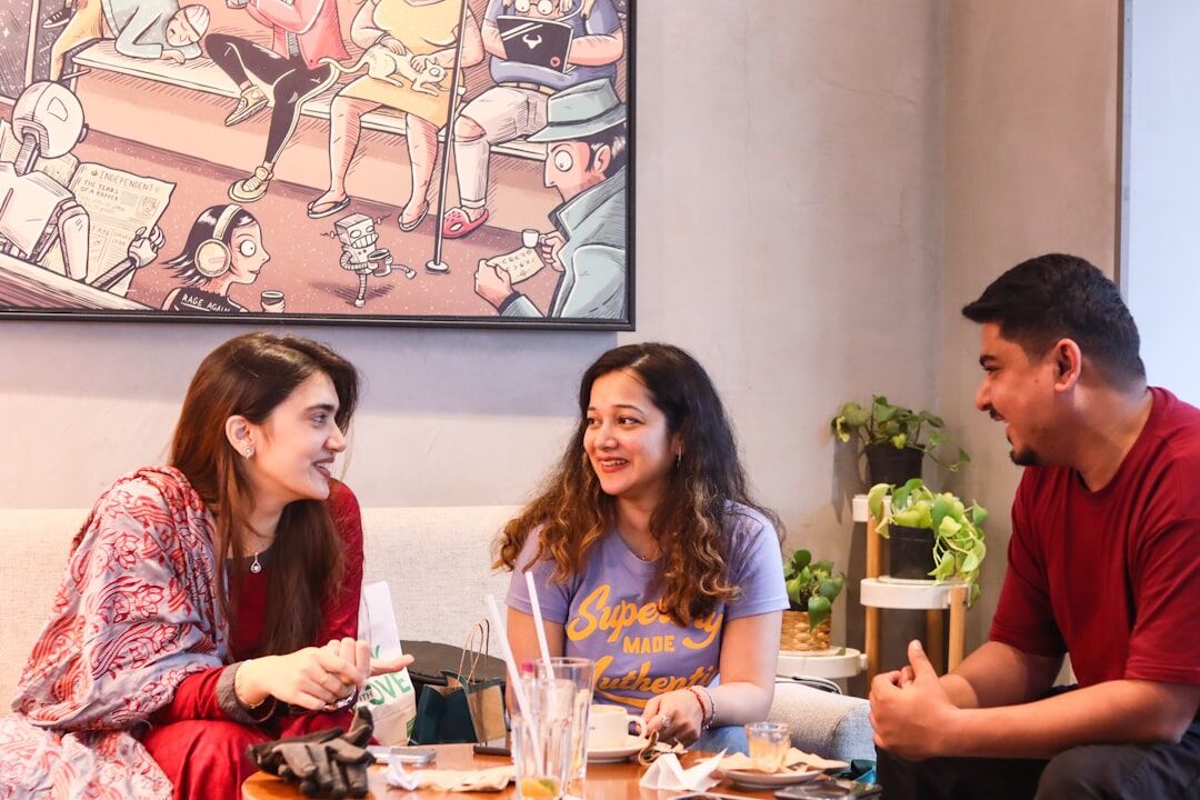 Team having a friendly conversation around a table