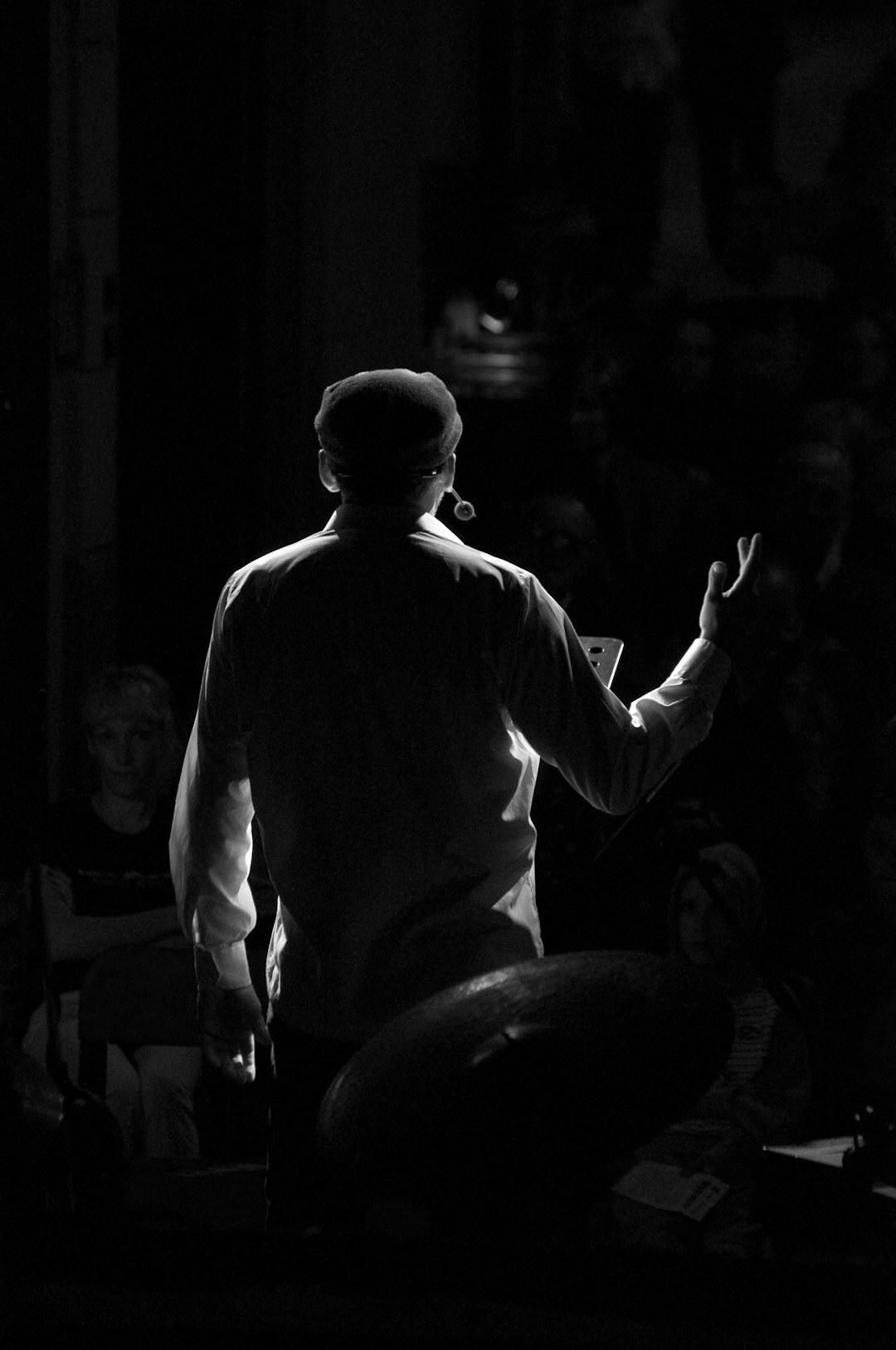 person giving speech on stage